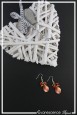 boucles-d-oreilles-chaine-capri-couleur-orange-sur-fond-noir